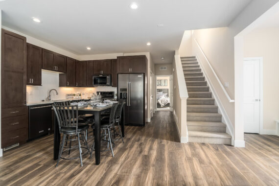 Model kitchen with view of staircase in Rendezvous Buckhorn Paired Cabins