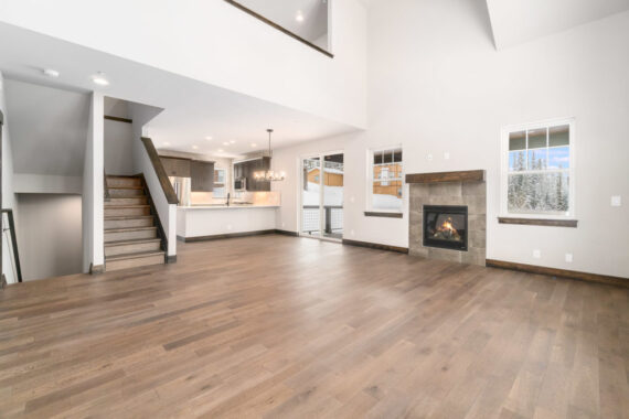 Model living room with fire place in Moosehorn Uphill Cabin