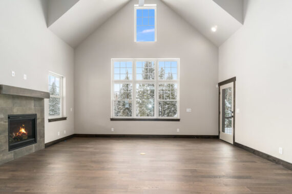 Model living room with fire place in Moosehorn Uphill Cabin