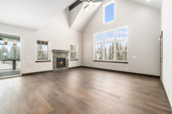 Model living room with fire place in Moosehorn Uphill Cabin