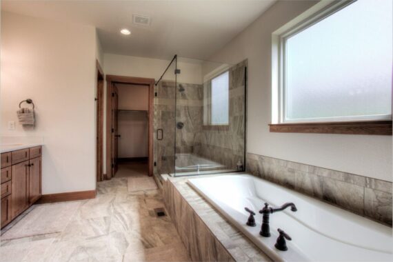 Oversized bathtub and walk in shower in Rendezvous Bighorn Cabin