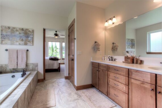 Primary bathroom in model home at Rendezvous Bighorn Cabin