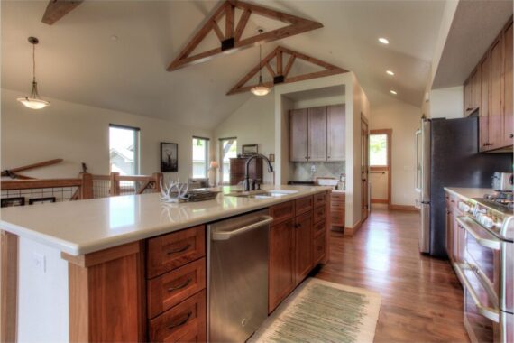 Furnished kitchen in model home at Rendezvous Bighorn Cabin