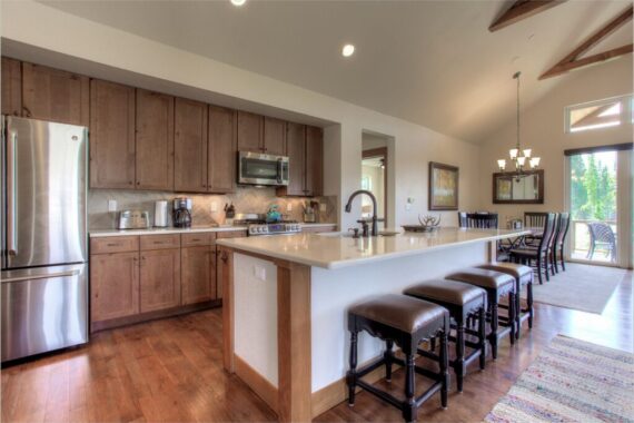 Furnished kitchen in model home at Rendezvous Bighorn Cabin