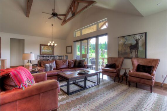 Furnished living room in model home at Rendezvous Bighorn Cabin