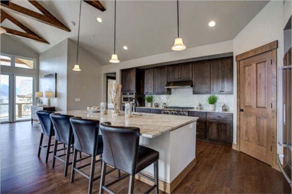 Furnished kitchen in model home at Rendezvous Bighorn Cabin II