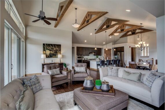 Furnished living room in model home at Rendezvous Bighorn Cabin II