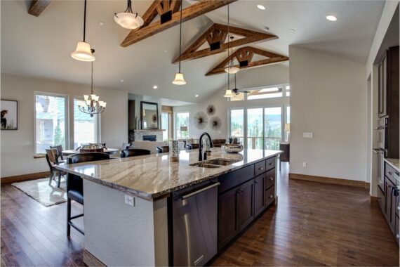 Furnished kitchen in model home at Rendezvous Bighorn Cabin II