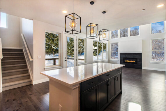 Modern kitchen and living area with winter view