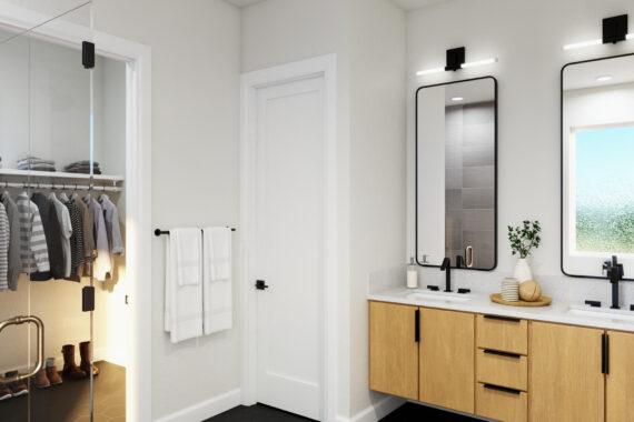 Modern primary bathroom with double vanity and closet