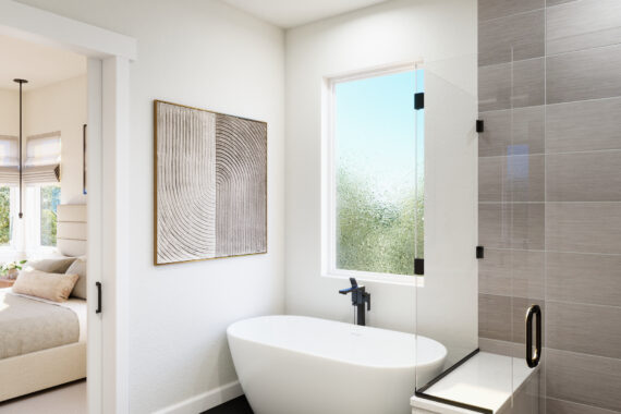 Modern primary bathroom with freestanding tub and frosted window