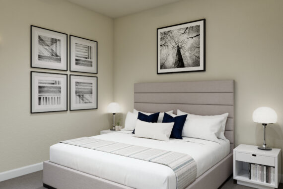 Bedroom with framed black and white tree pictures