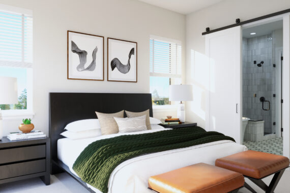 Modern bedroom with green blanket, framed abstract art