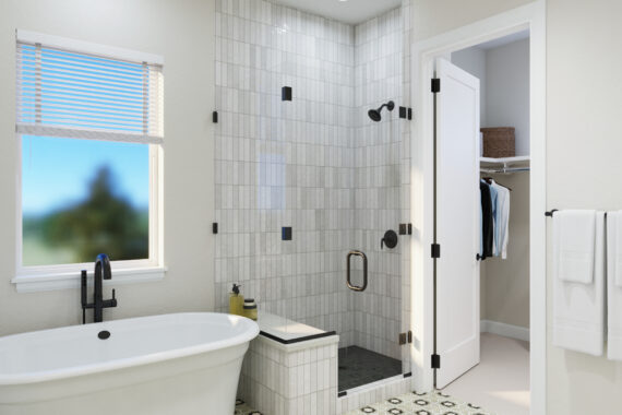 Modern bathroom with bathtub, shower, and open closet door